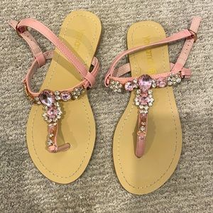 Pale pink jewelled sandals.
